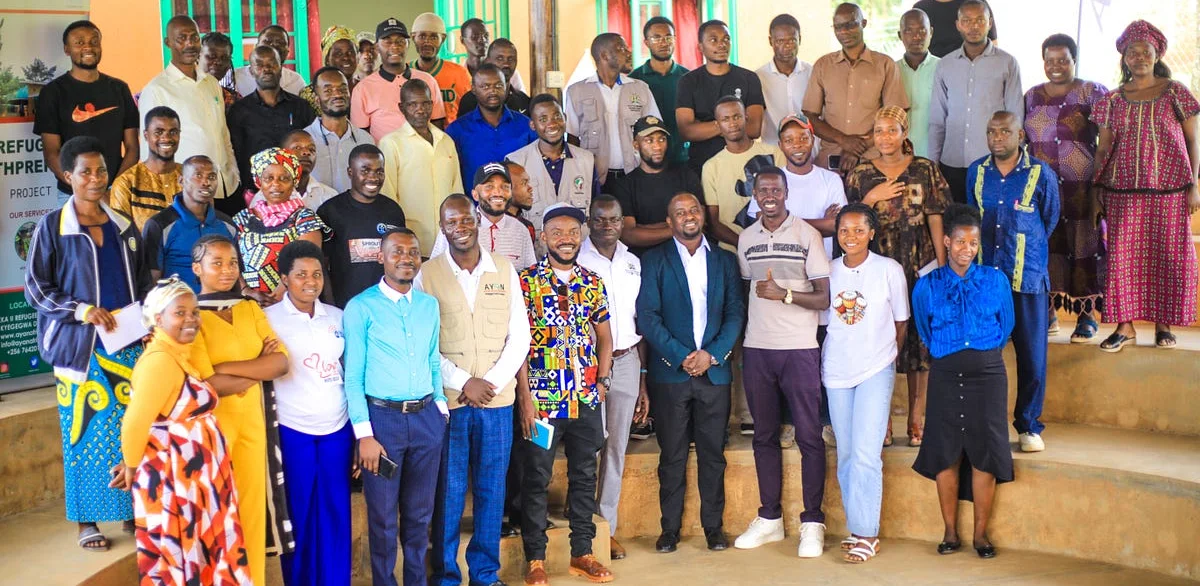 All participants and facilitators gathered for a group photo at the end of the training in Kyaka II